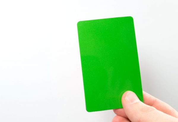 Grönt/Rött vändbart plastkort som fäster mot magnet